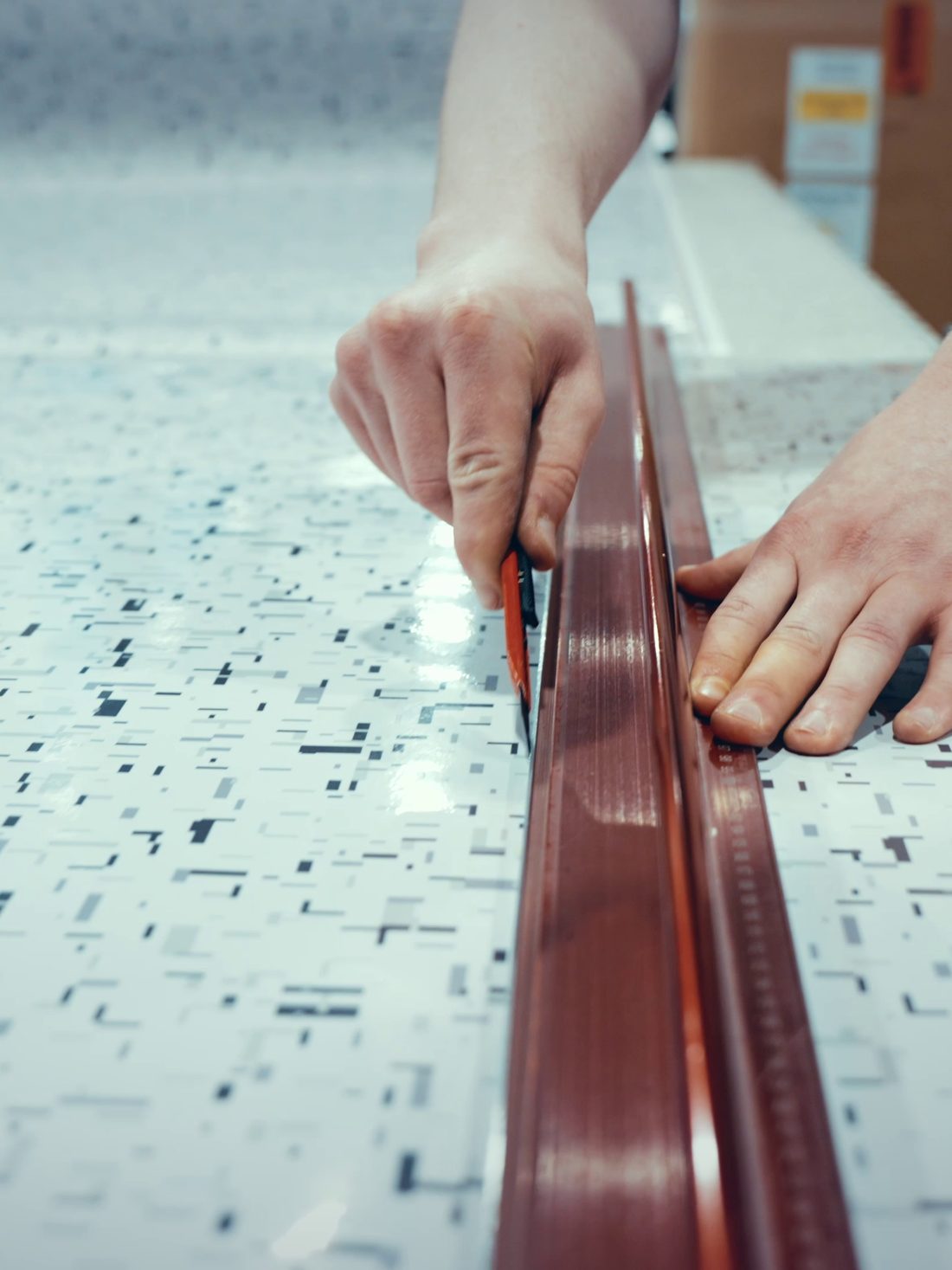 Film being worked flat across a workbench