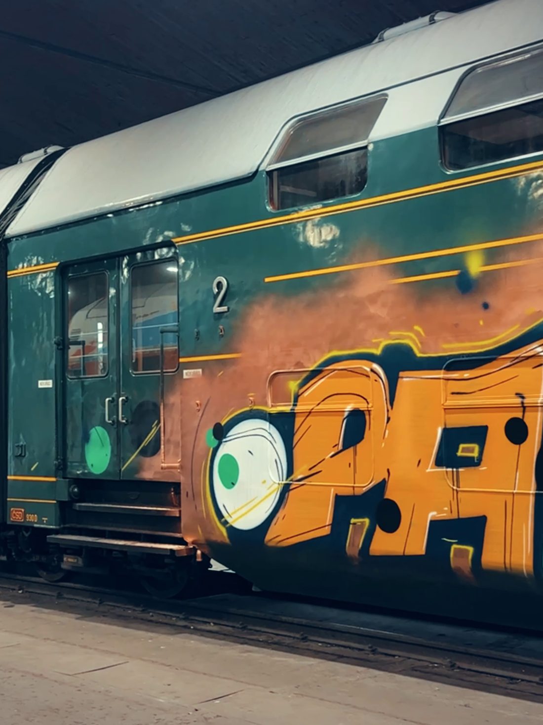 A tagged railcar in the depot at night
